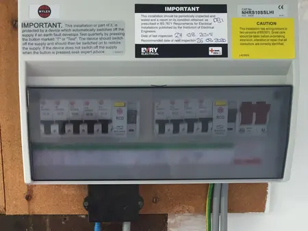 The consumer unit that replaced it, labelled and certified.
